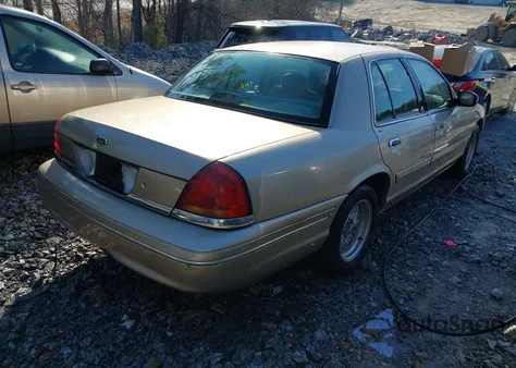 1999 Ford Crown Victoria Lx z USA, uszkodzony, nr VIN 2FAFP74W6XX228356